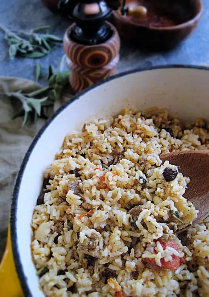 Savory Lamb Pilaf from the Balkans. Fresh sage, parsley, raisins and lamb come together to make this exotic rice dish from eastern Europe. Easy to make and super yum!