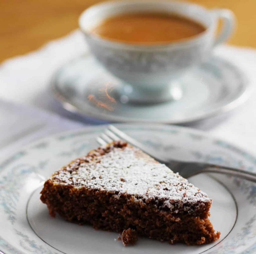 Swedish Dark Cake aka Svensk Mork Kaka is a lovely cake spiced with cinnamon, cloves and cocoa. This cake is EASY! I lOVED making this cake. | FusionCraftiness.com