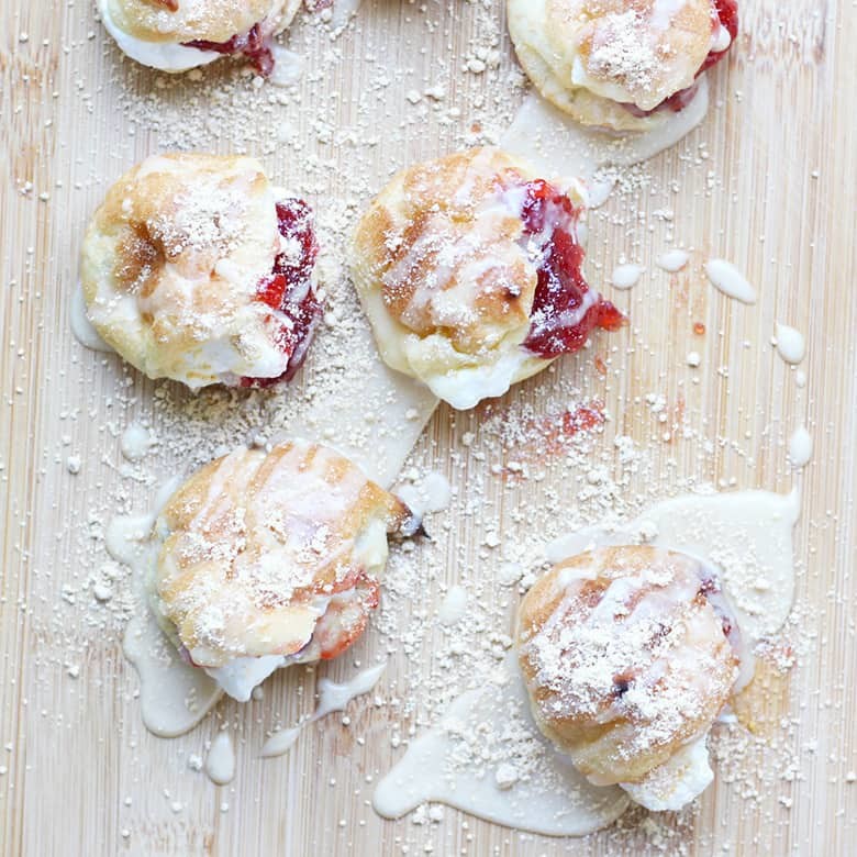 Peanut Butter and Jelly Cream Puffs, where an American classic meets a French classic. Cream puffs filled with jelly and whipped cream then topped with a peanut butter icing, then sprinkled with powdered peanut butter from Peanut Butter & Co.