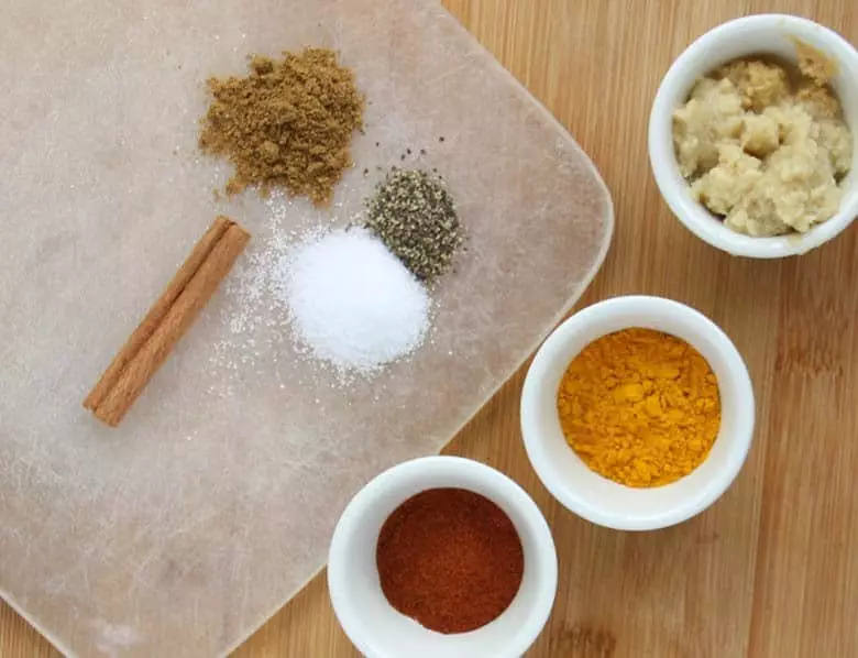 Spices on a cutting board.