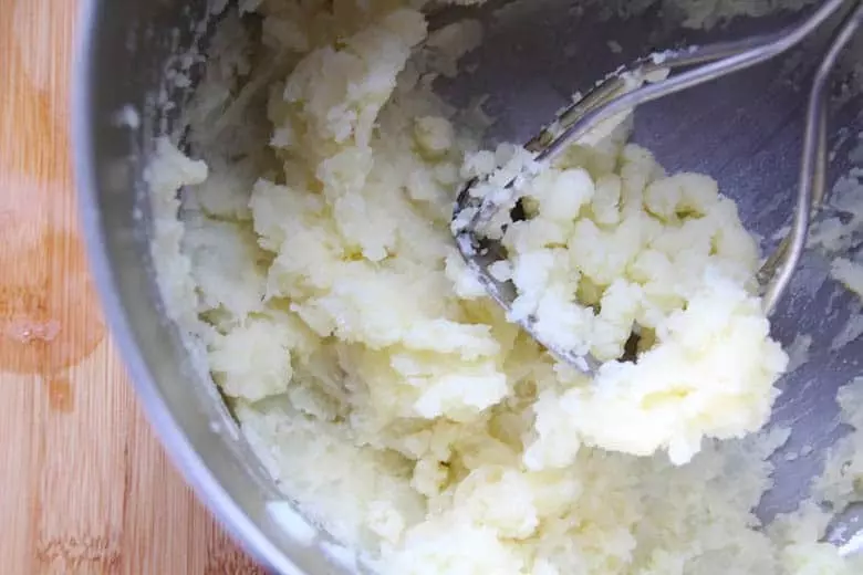 Potatoes all mashed up with butter.