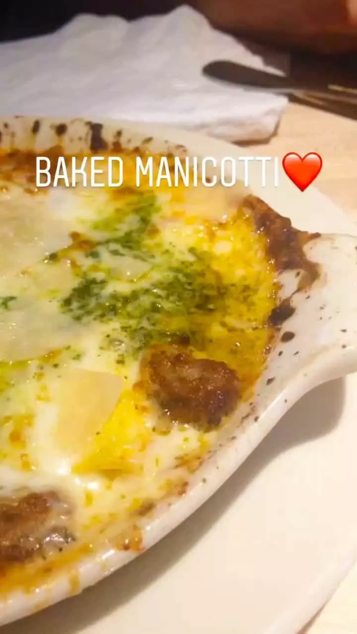 A plate of baked manicotti.