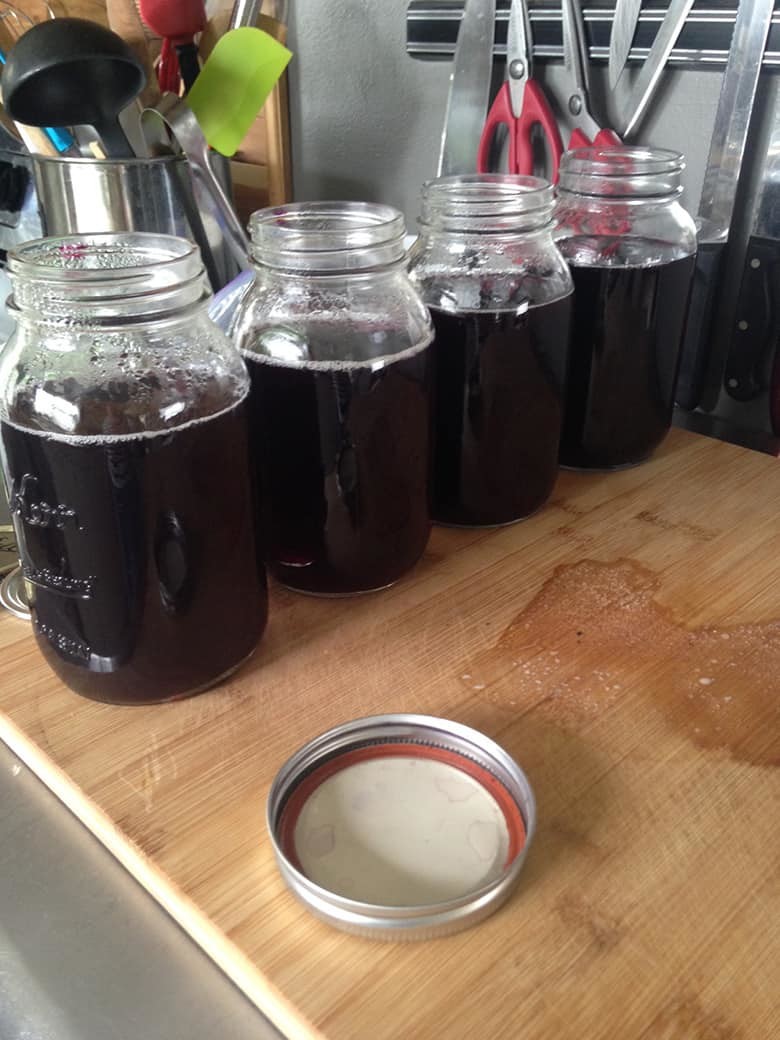 Homemade grape juice in mason jars.