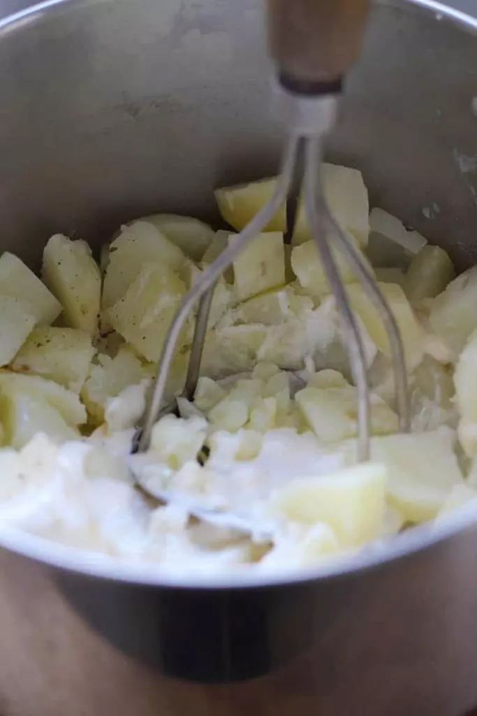 Easy Traditional Irish Colcannon Recipe, a tasty bowl of comfort food that can be whipped up in a snap! Make this the next time you need a hardy side or a meal for St. Patricks Day. | FusionCraftiness.com