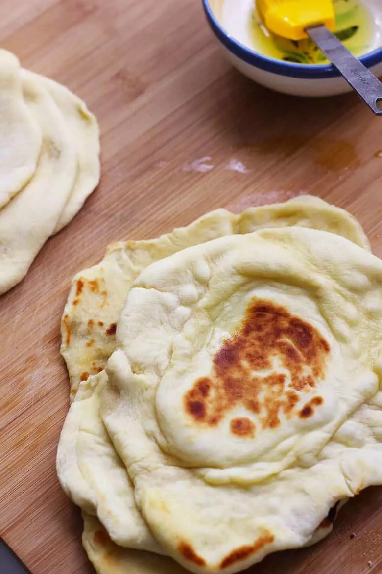 A stack of naan flatbreads.