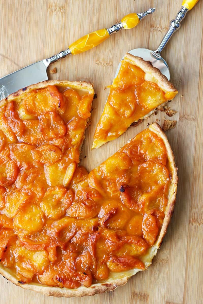 French Apricot Tart Recipe | Tarte Aux Abricots. Making French tarts is really easy to make. The crust comes together nicely in a food processor and the fresh fruit makes for a perfect dessert. This apricot tart recipe will impress your friends and feed a crowd. A perfect dessert for Bastille Day!
