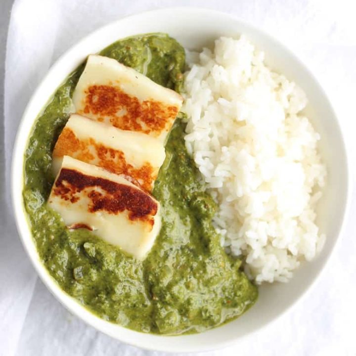 Spinach Curry with Paneer, also known as Palak Paneer, is a super healthy dish from Northern India packed with spinach and Indian spices. Paneer cheese is fried and added to this super easy Indian curry. This dish is spicy but not hot. | FusionCraftiness.com | Curry | Palak | Paneer | Indian food