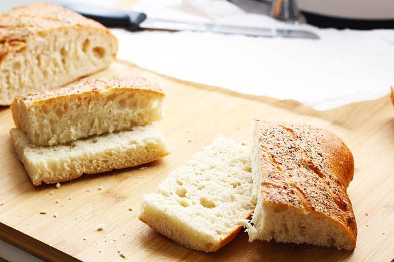 Ciabatta bread cut into fourths.