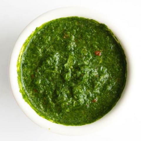 Green chutney in a small bowl.