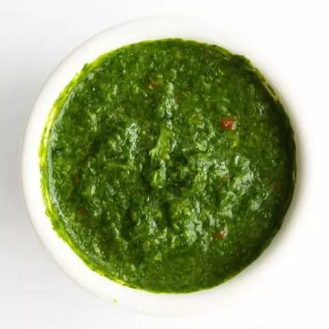 Green chutney in a small bowl.
