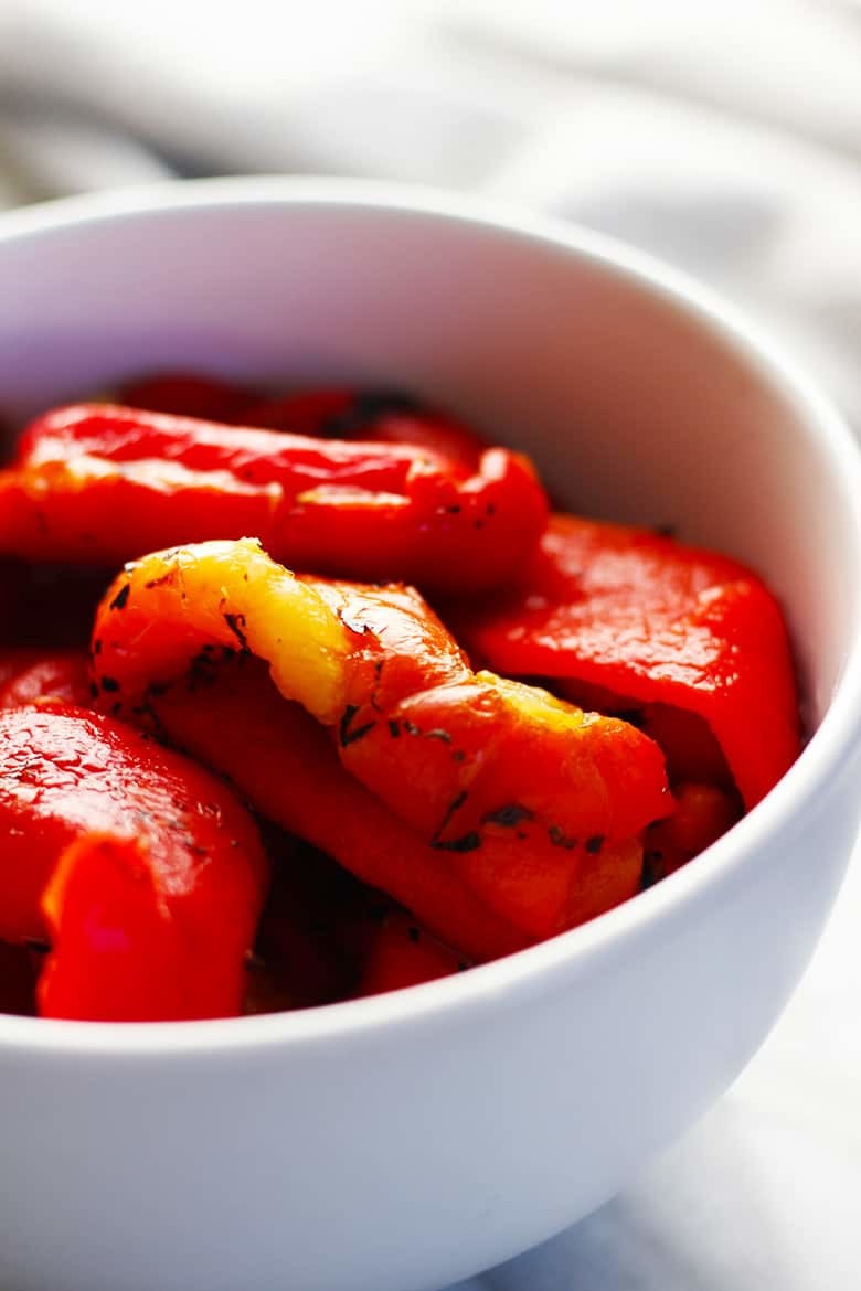 A bowl of roasted red bell peppers.