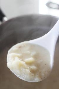 A ladle of potato soup.