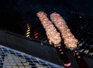Raw ground meat on a skewer.