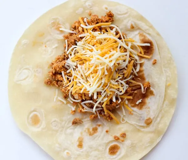 Open faced taco with chorizo, egg and cheese.