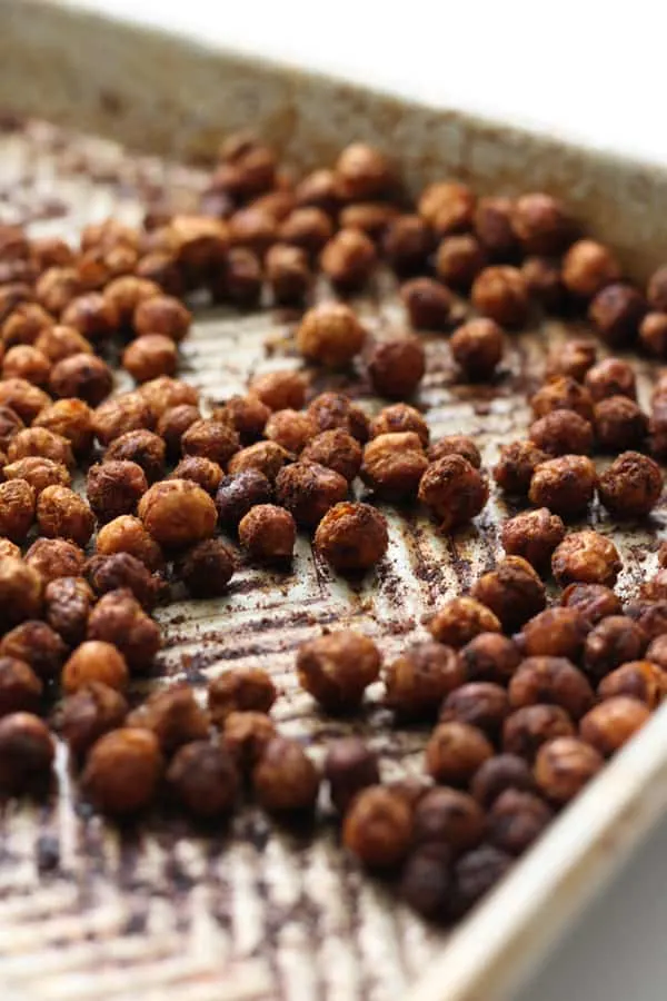Roasted chickpeas on a baking sheet.