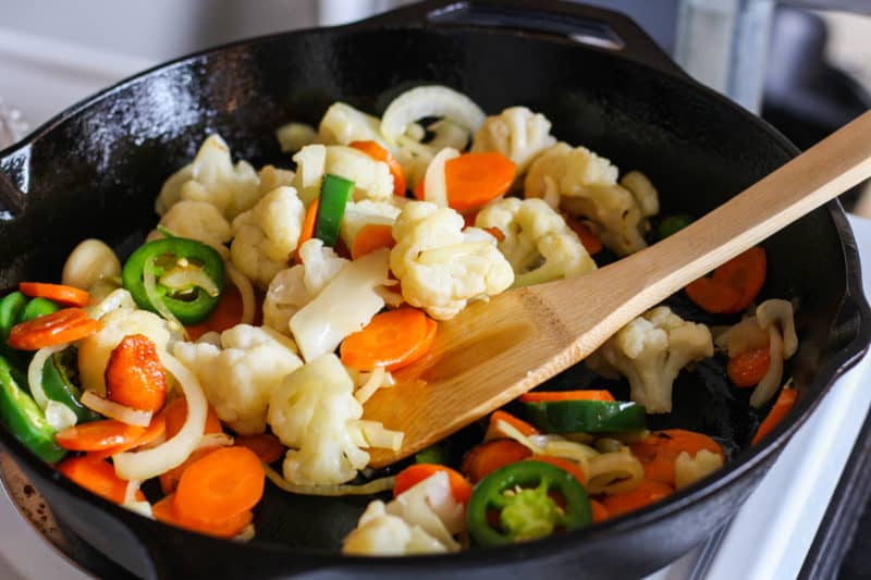 Vegetables in a cast iron skillet.