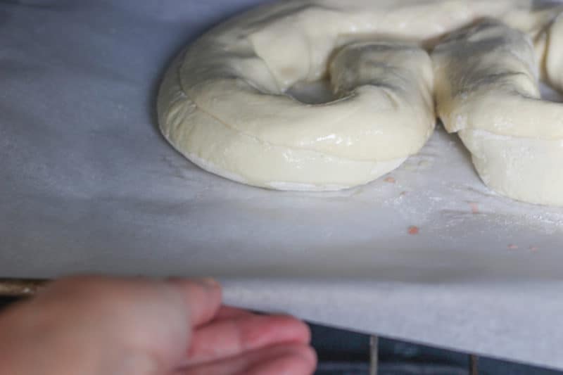 Placing Kringle in oven.