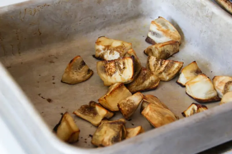 Roasted eggplants in a roasting pan.