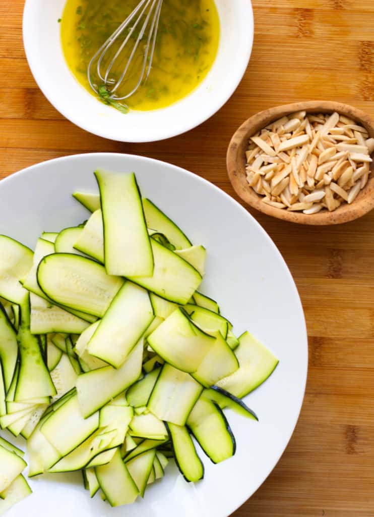Zucchini, dressing and toasted almonds.