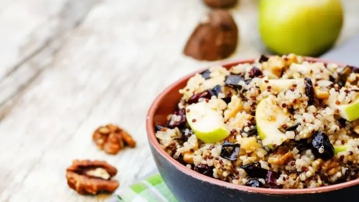 Quinoa breakfast bowl with apples and walnuts.