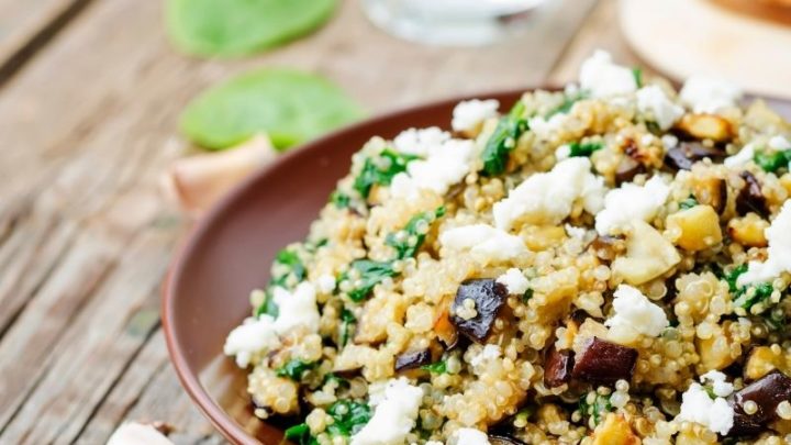 Quinoa salad with feta cheese, spinach and olives.