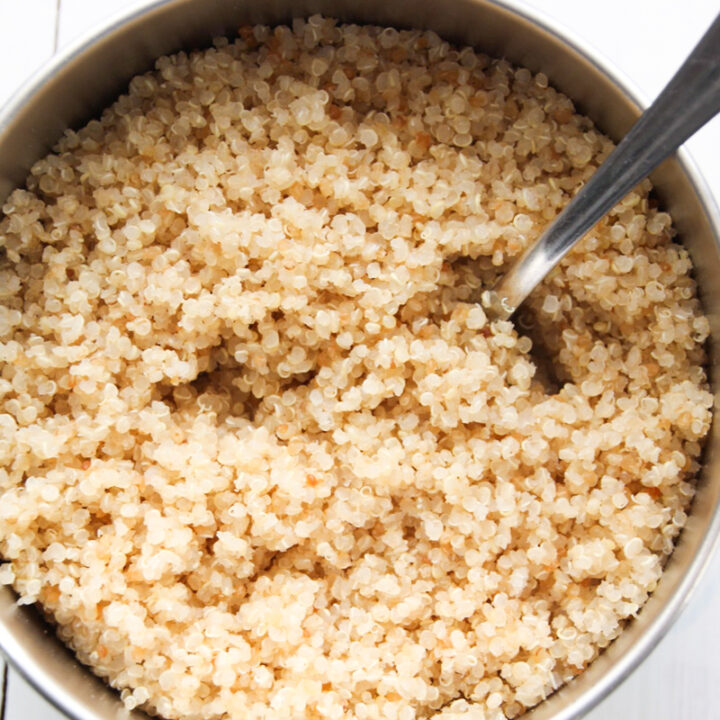 Cooked quinoa in a small pan.