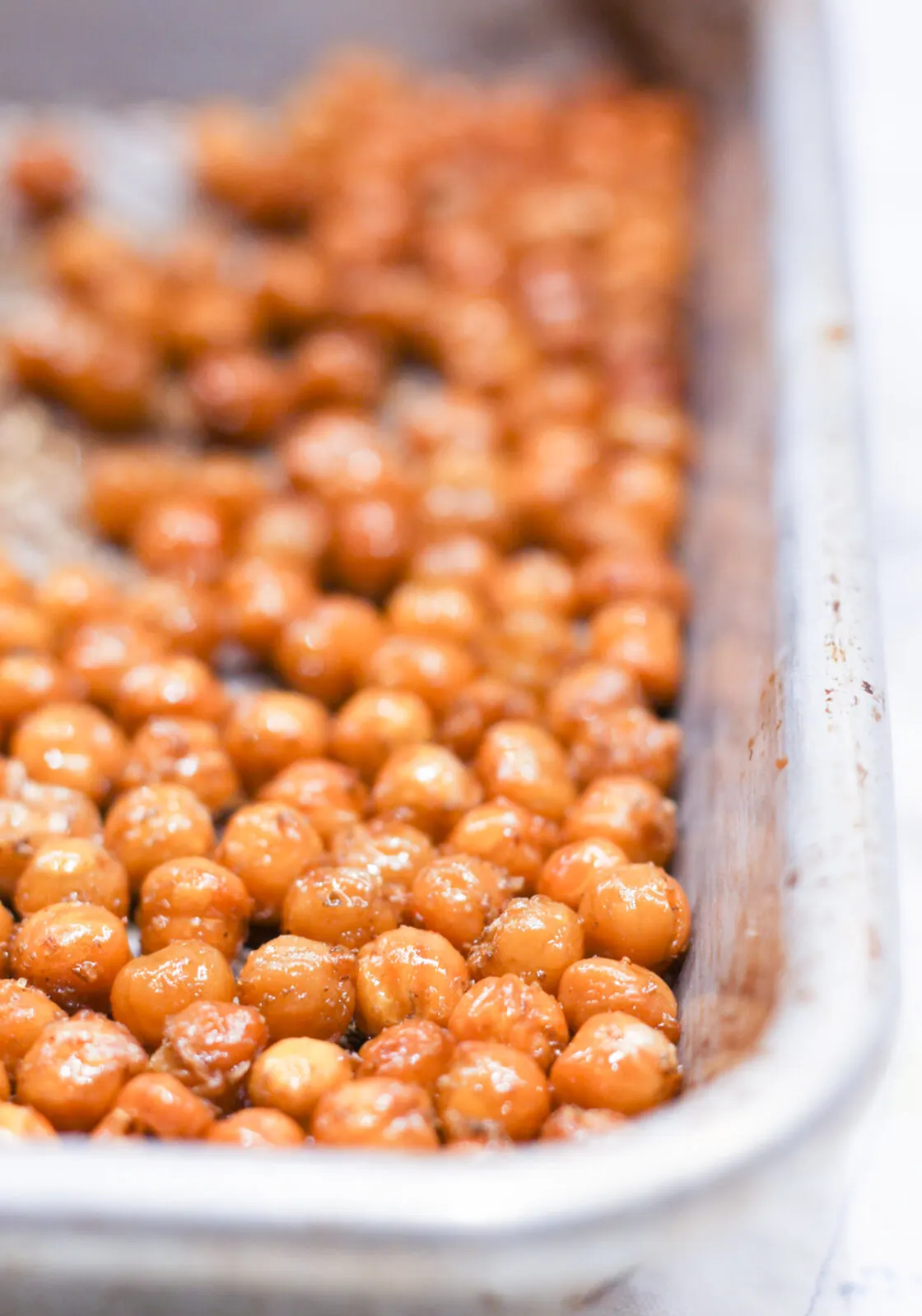 Toasted chickpeas on a baking sheet.